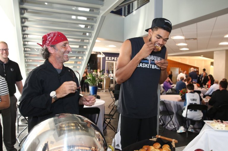 Karl-Anthony Towns of the Timberwolves samples some of David Fhima’s clean, healthy, organic food offerings (Photo credit: David Sherman)
