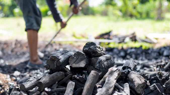 Farmers burn charcoal from wood cut off from the farm.
