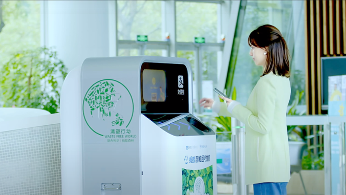 Person puts bottle into AI recycling machines